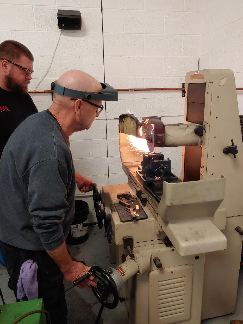 Paul teaching Ryan how to grind a notch in M4 die