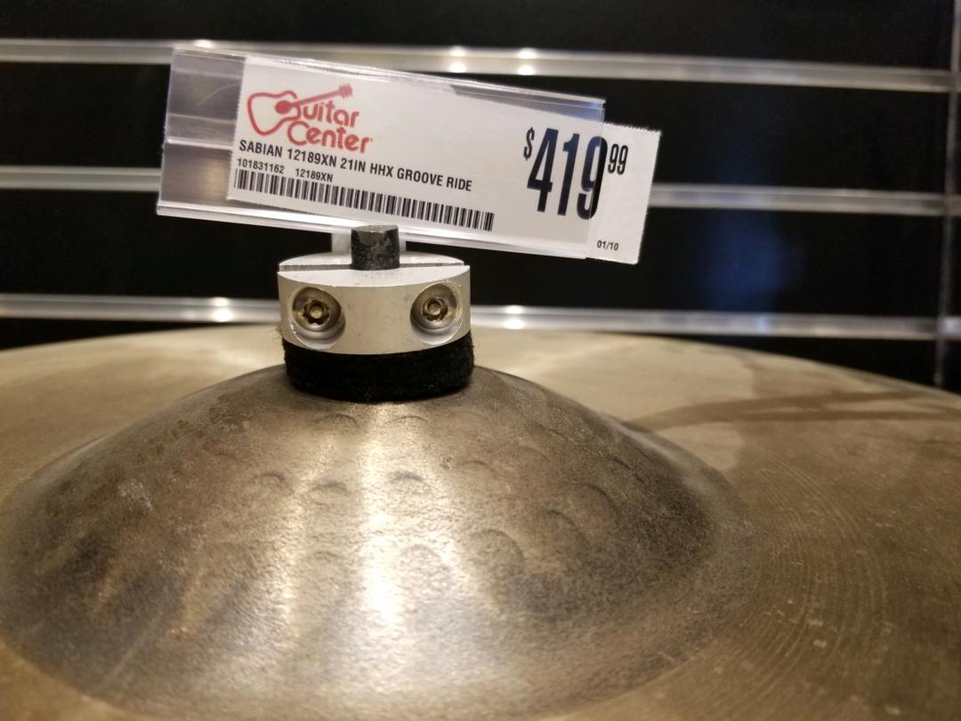 close up of key-rex securing brass cymbal